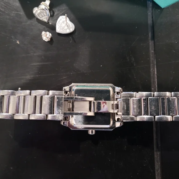 Bulova woman's watch & Tiffany &Co earings